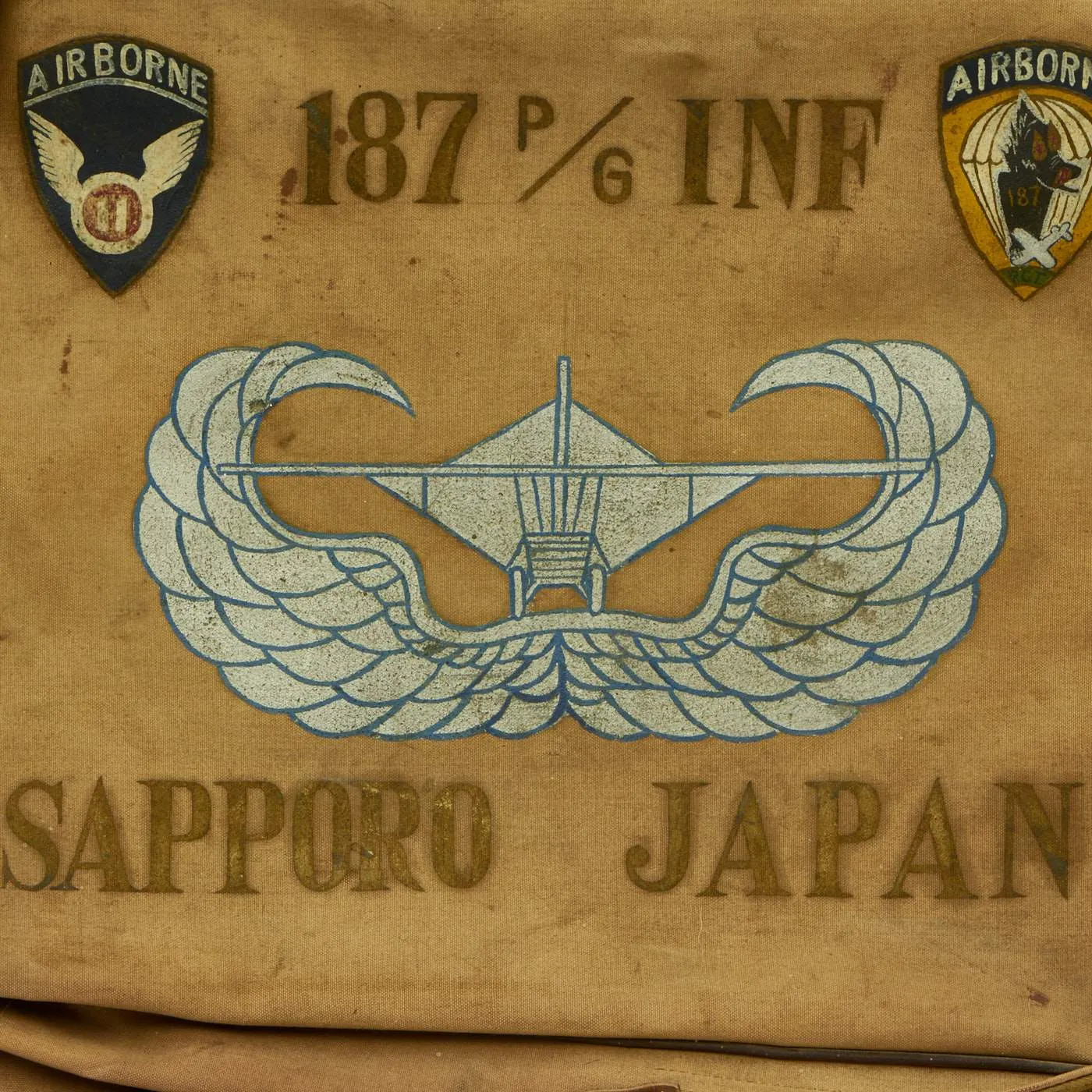 Original U.S. WWII 187th Glider Infantry Regiment (GIR) Named Ike Jacket and Hand Painted B-4 Bag